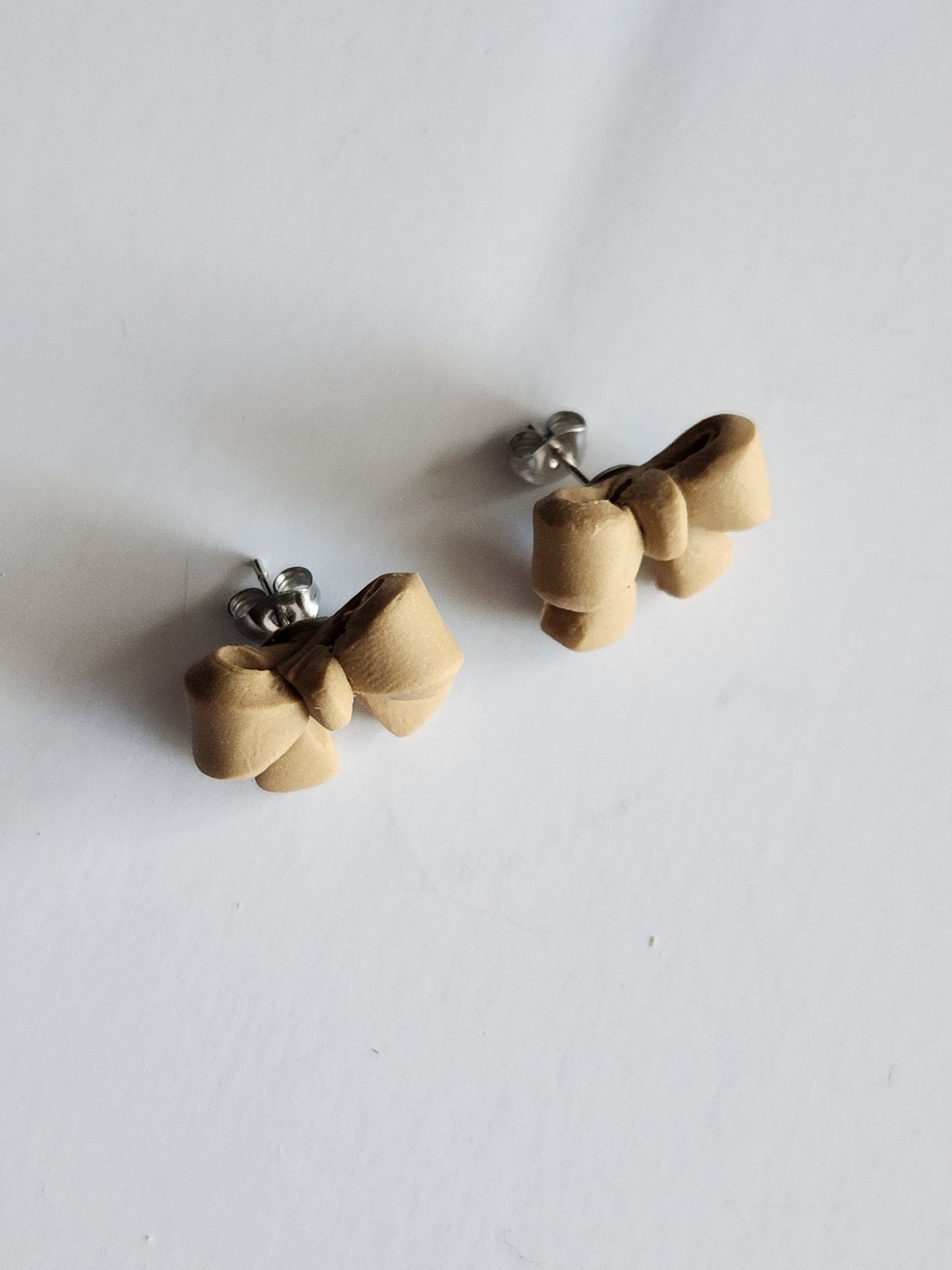 Tan Bow Studs